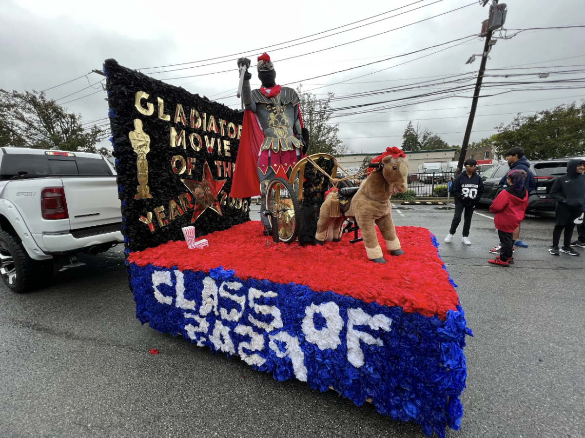 Seventh graders gather to march with their float in the Homecoming parade.